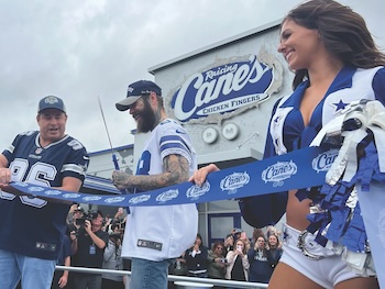 Raising Canes Founder & CEO Todd Graves cuts the ribbon with Post Malone at the grand opening of the Canes/ Post/Dallas Cowboys restaurant collab.
